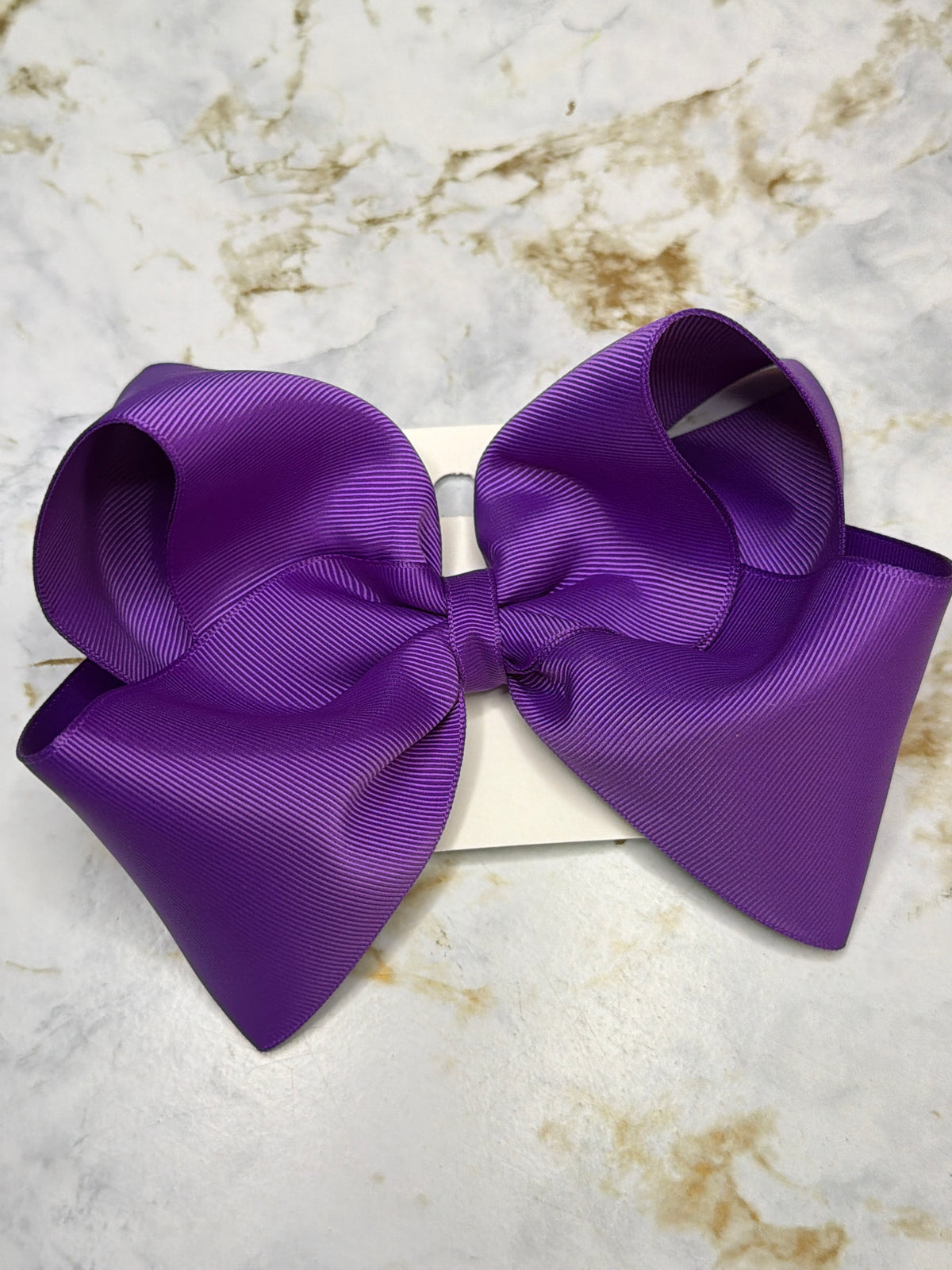Large purple bow