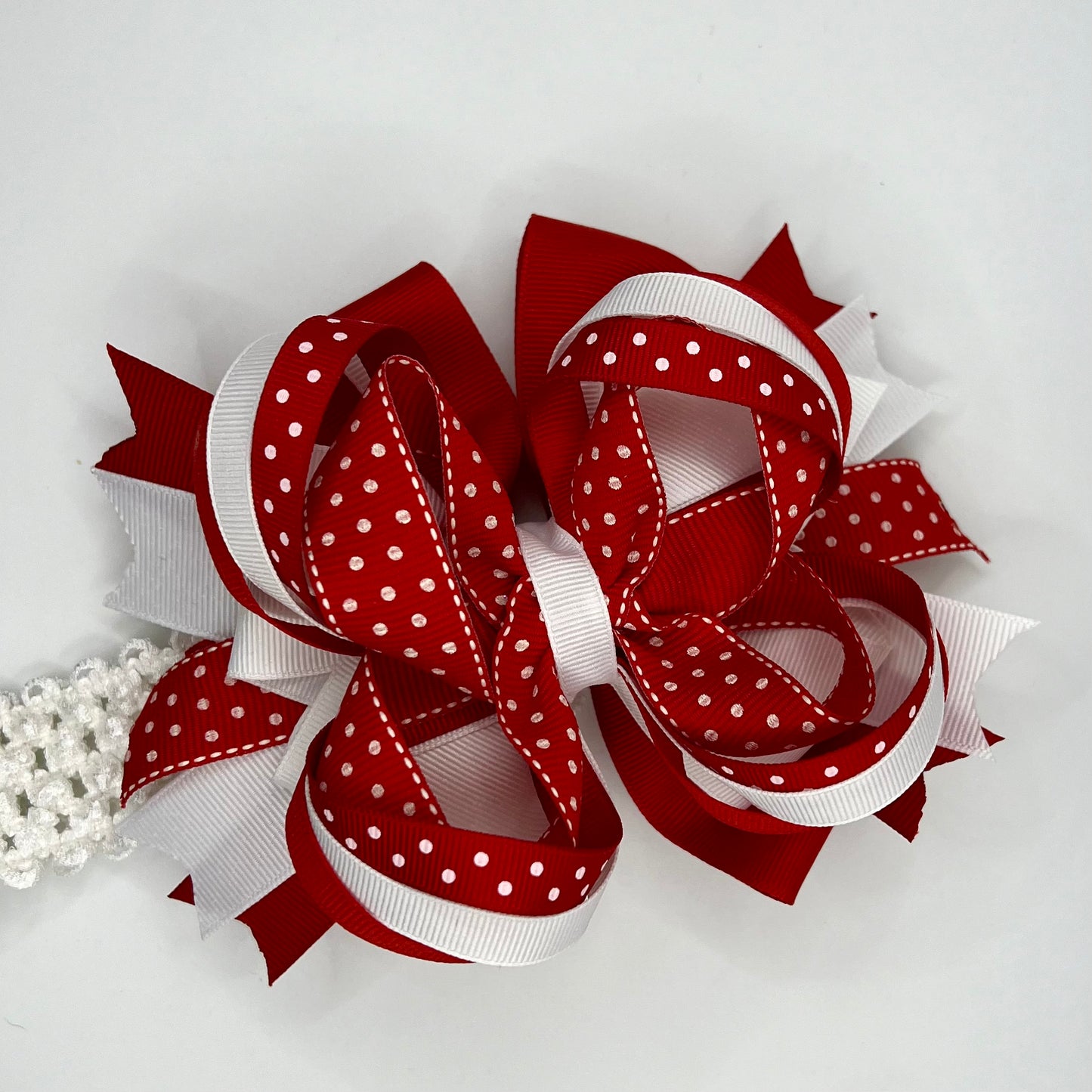 Red and white polkadot bow on the headband